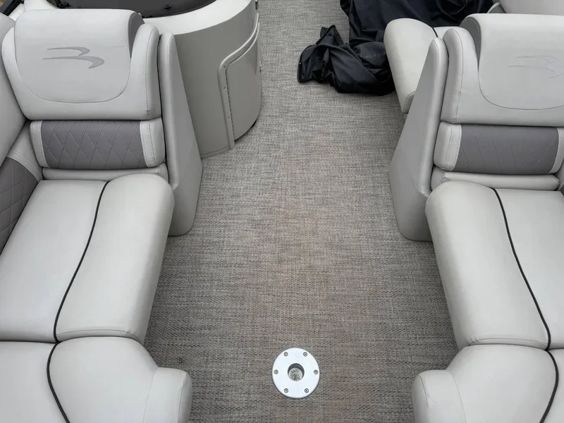 Slide: The Image of 2017 Bennington 226 GSR boat interior with gray seating and carpet flooring. - 9