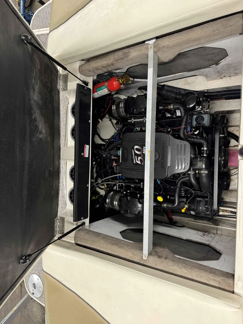Slide: The Image of Engine compartment of a 2007 Sea Ray 230 Select boat, featuring a MerCruiser engine. - 10