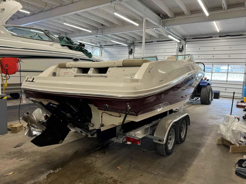 Slide: The Image of 2007 Sea Ray 230 Select boat on trailer in indoor storage facility. - 4
