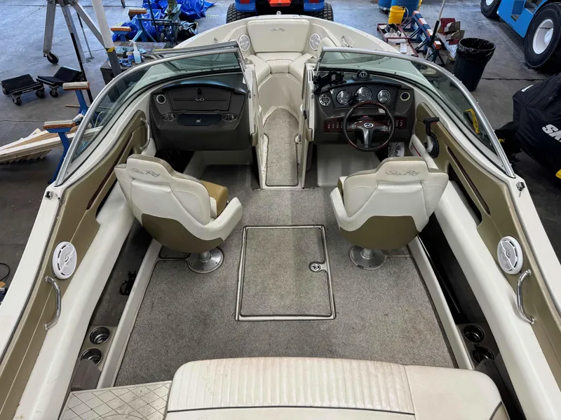 Slide: The Image of 2007 Sea Ray 230 Select boat interior with dual seats and dashboard controls. - 6
