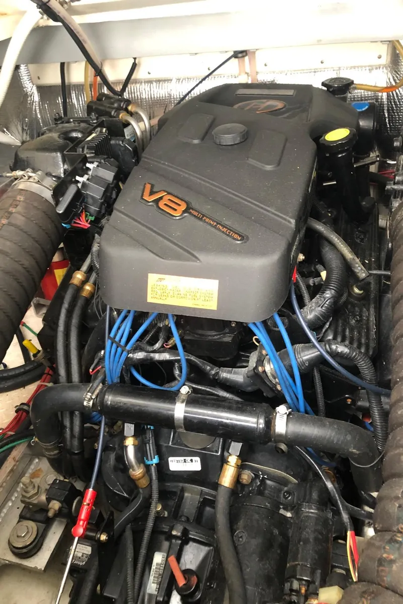 Slide: The Image of V8 engine of a 2000 Rampage 30 Express boat, showcasing detailed components. - 13