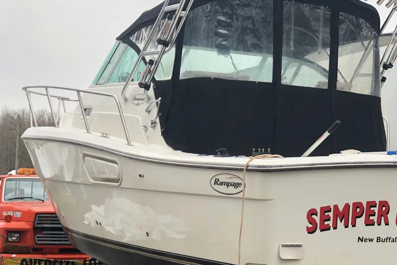 Slide: The Image of 2000 Rampage 30 Express boat with black canopy, docked in New Buffalo. - 4