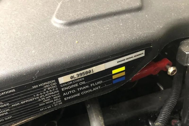 Slide: The Image of Engine serial number on 2000 Rampage 30 Express, showing color codes for fluids. - 7