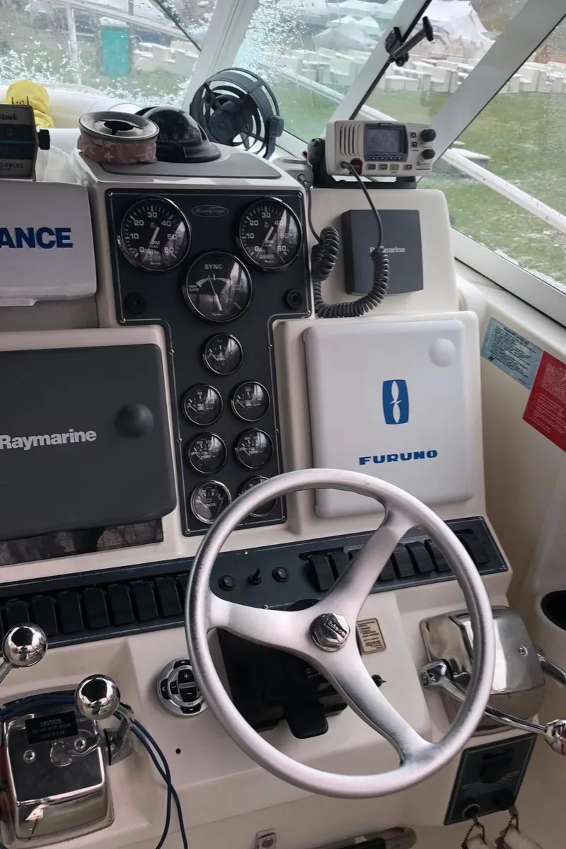 Slide: The Image of Control panel of a 2000 Rampage 30 Express boat with navigation equipment. - 9