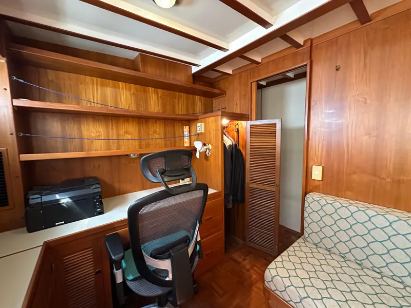 Slide: The Image of Cozy interior of 1997 Kadey-Krogen 48 Whaleback with seating, desk, and window. - 28