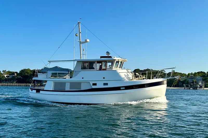 Slide: The Image of 1997 Kadey-Krogen 48 Whaleback yacht cruising on a sunny day. - 3