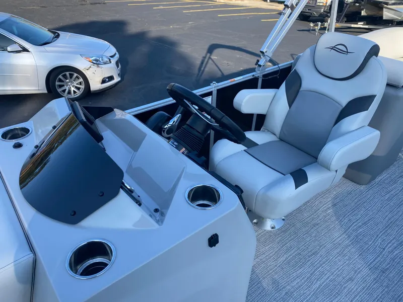 Slide: The Image of Captain's chair and console of 2025 SunCatcher Select 322RC boat. - 14