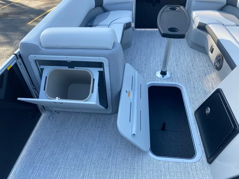 Slide: The Image of 2025 SunCatcher Select 322RC interior with open storage compartments and seating. - 15