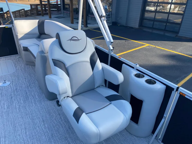 Slide: The Image of Luxurious seating on 2025 SunCatcher Select 322RC pontoon boat with cup holders. - 16
