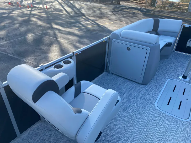 Slide: The Image of Interior of 2025 SunCatcher Select 322RC pontoon boat with plush seating and cup holders. - 22