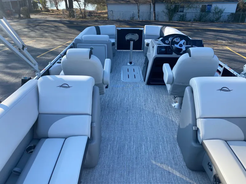 Slide: The Image of Interior of 2025 SunCatcher Select 322RC pontoon boat with plush seating and modern dashboard. - 23