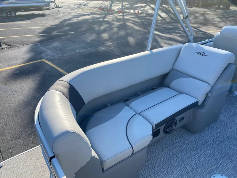 Slide: The Image of 2025 SunCatcher Select 322RC boat seating with gray upholstery and integrated speakers. - 24