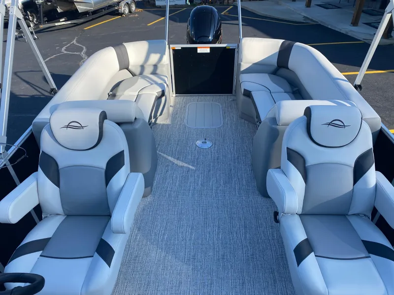 Slide: The Image of 2025 SunCatcher Select 322RC pontoon boat interior with plush seating and modern design. - 6