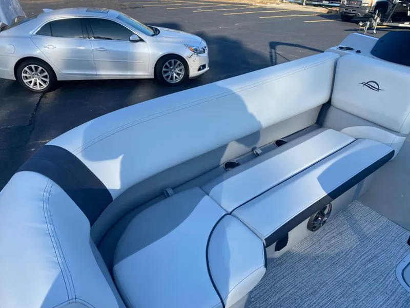 Slide: The Image of 2025 SunCatcher Select 322RC boat interior with plush seating and sleek design. - 9