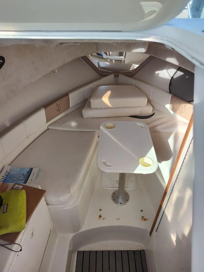 Slide: The Image of Interior cabin of 2003 Seaswirl Striper 2601 Walkaround I/O with seating and table. - 14