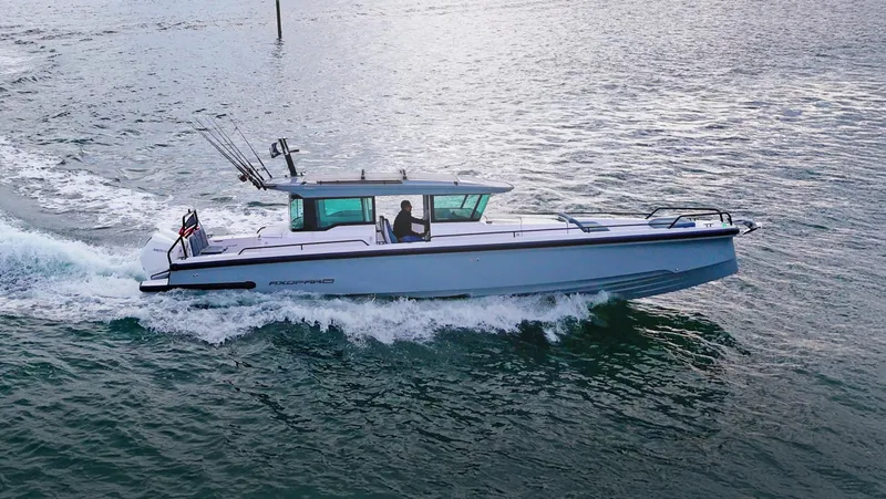 The Image of 2023 Axopar 37 XC CROSS CABIN cruising on open water. - 0