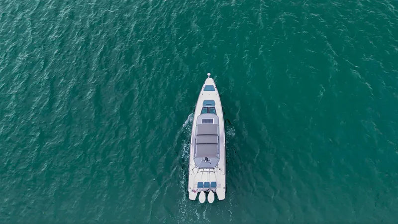 Slide: The Image of Aerial view of 2023 Axopar 37 XC CROSS CABIN on open water. - 10