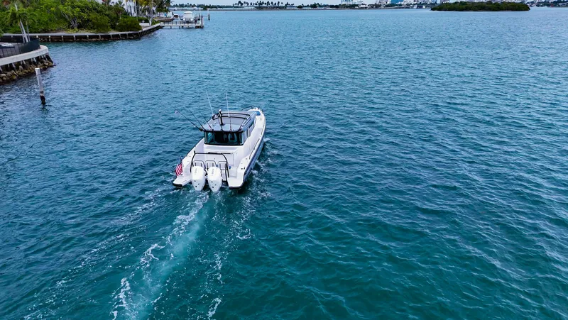 Slide: The Image of 2023 Axopar 37 XC CROSS CABIN cruising on open water. - 17