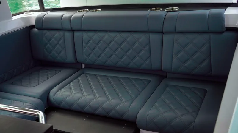 Slide: The Image of Luxurious seating in the 2023 Axopar 37 XC CROSS CABIN with quilted upholstery. - 32