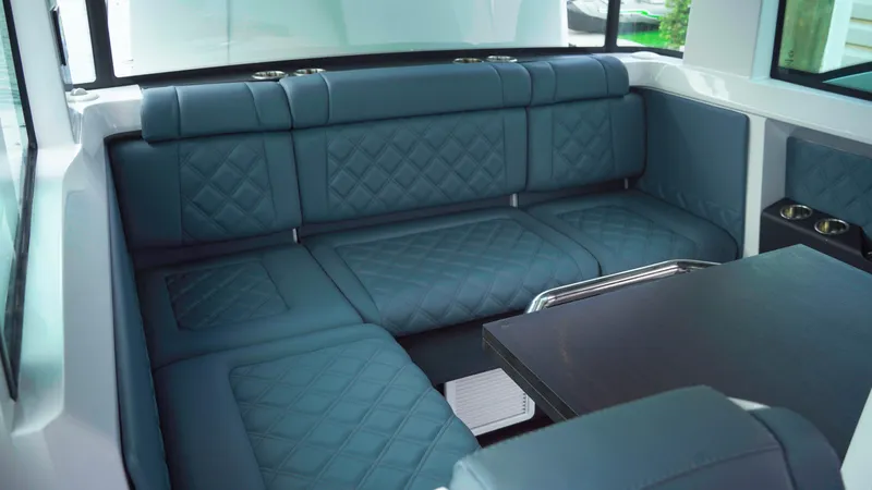 Slide: The Image of Luxurious seating area in 2023 Axopar 37 XC CROSS CABIN with quilted upholstery. - 33