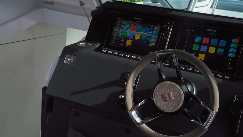 Slide: The Image of Steering wheel and dashboard of 2023 Axopar 37 XC CROSS CABIN boat. - 37