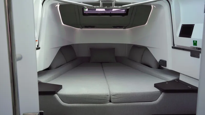 Slide: The Image of 2023 Axopar 37 XC CROSS CABIN interior with modern, spacious sleeping area. - 40