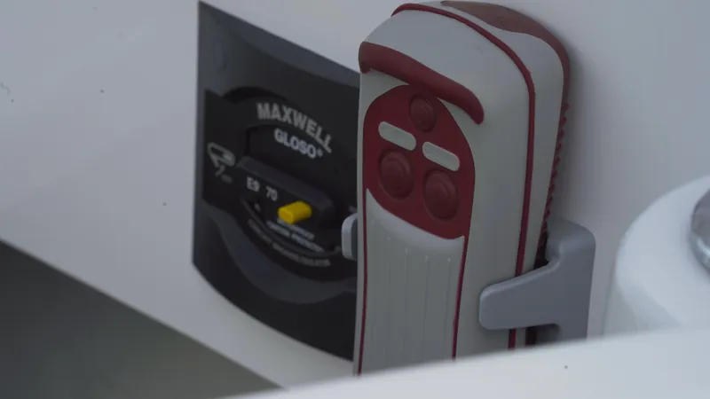 Slide: The Image of Control panel and remote on 2023 Axopar 37 XC CROSS CABIN boat. - 42