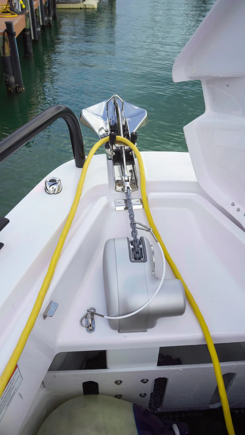 Slide: The Image of 2023 Axopar 37 XC CROSS CABIN anchor system with yellow rope on deck. - 43