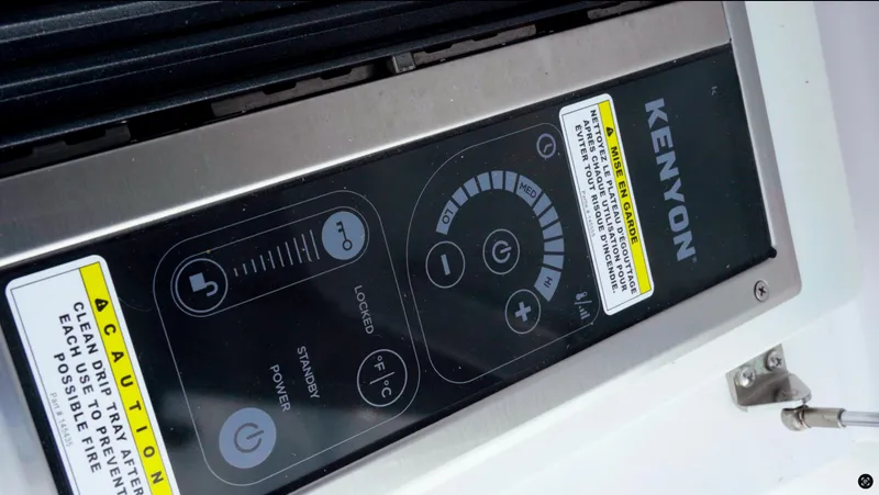 Slide: The Image of Control panel of Kenyon appliance on 2023 Axopar 37 XC CROSS CABIN boat. - 8