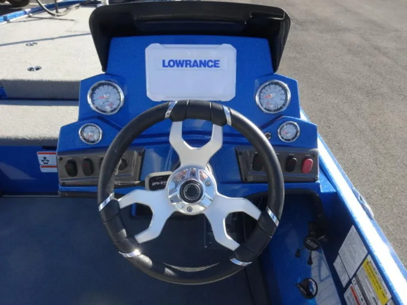 Slide: The Image of 2023 Nitro Z18 boat dashboard with Lowrance display and steering wheel. - 11