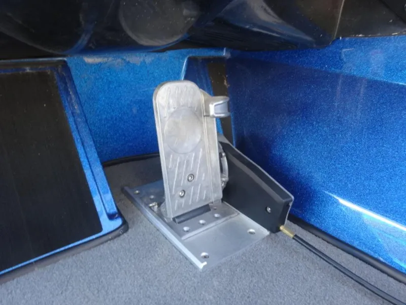 Slide: The Image of Foot pedal in a 2023 Nitro Z18 boat, metallic blue interior. - 13