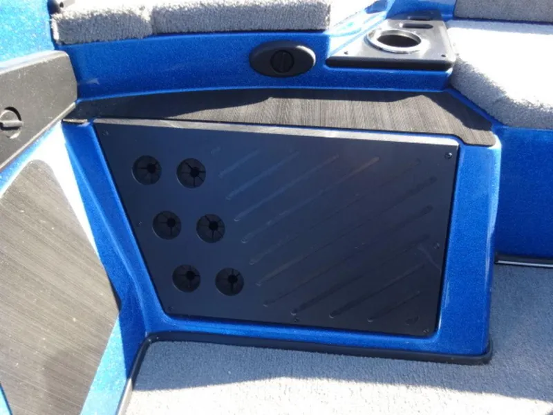 Slide: The Image of 2023 Nitro Z18 boat interior with blue panel and cup holder. - 14