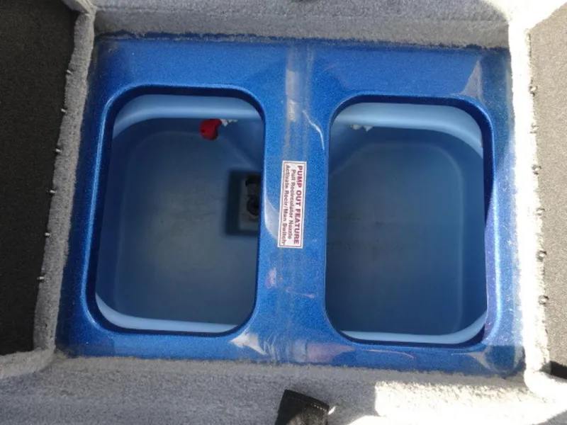 Slide: The Image of 2023 Nitro Z18 livewell compartments, blue interior, open lid view. - 16