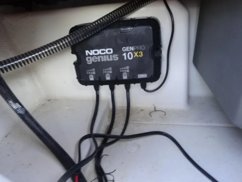 Slide: The Image of NOCO Genius GENPRO 10 X3 charger installed in Nitro Z18, 2023 model. - 18