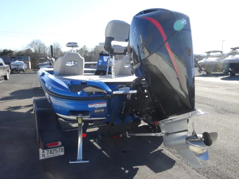 Slide: The Image of 2023 Nitro Z18 boat with powerful outboard motor, parked on a trailer in a marina. - 7