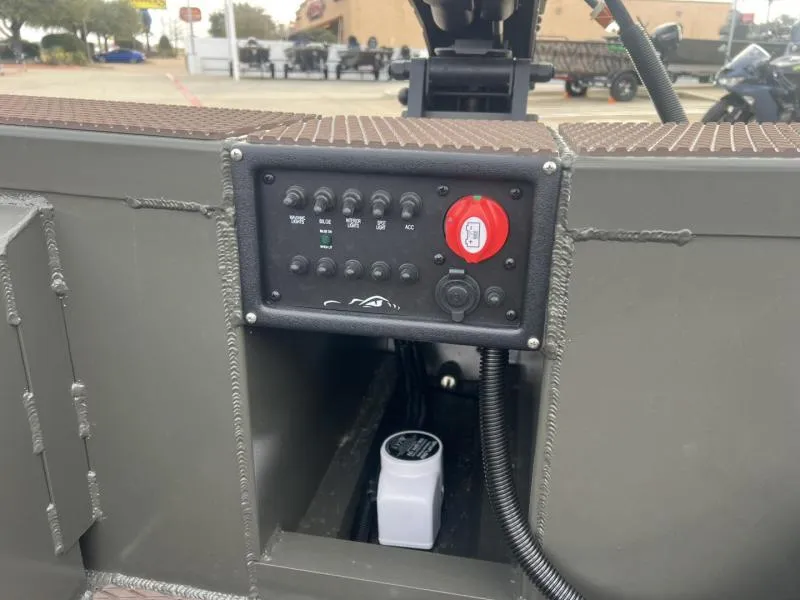 Slide: The Image of Control panel of 2025 Gator Tail 17/48 Gator Series boat, featuring switches and a red knob. - 12