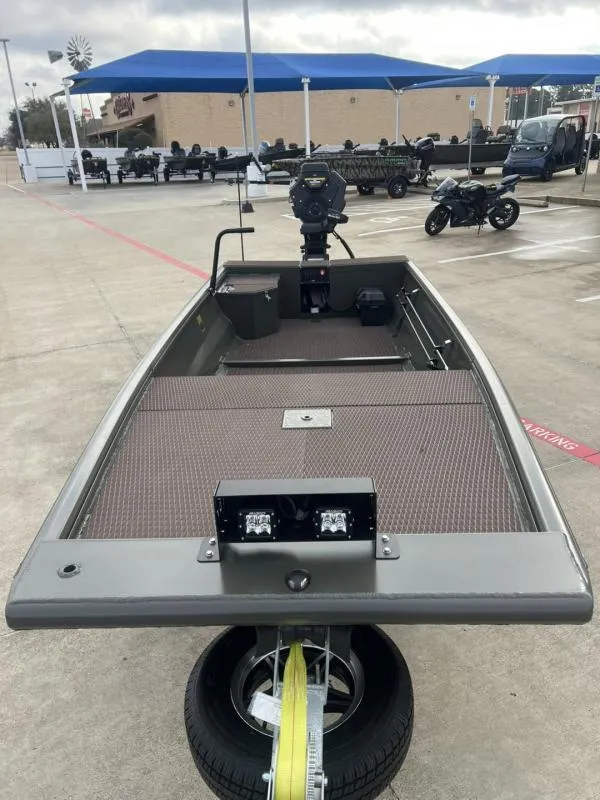 Slide: The Image of 2025 Gator Tail 17/48 Gator Series boat on trailer in parking lot. - 8