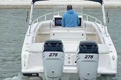 Slide: The Image of 2006 Marlago FS 35 Cuddy boat with dual 275 engines on water. - 5