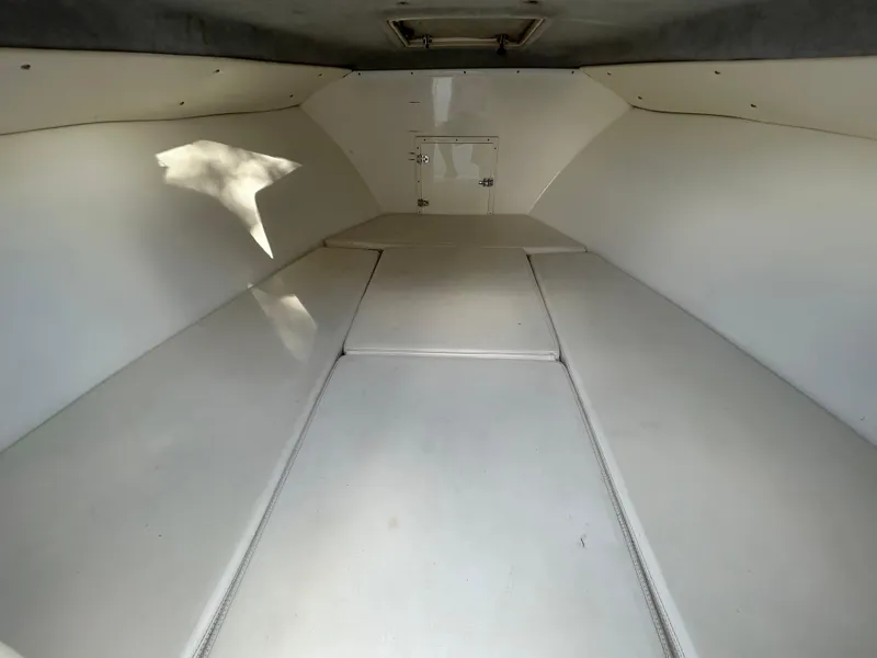 Slide: The Image of 2001 Contender 27' cuddy cabin interior, spacious and clean design. - 13