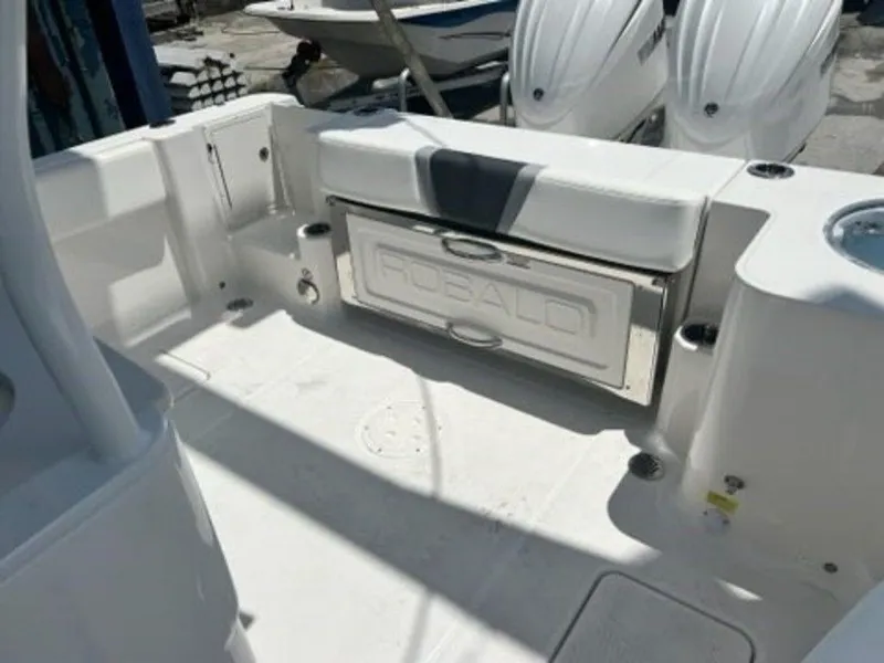 Slide: The Image of 2025 Robalo R270 Center Console boat interior with seating and storage. - 16