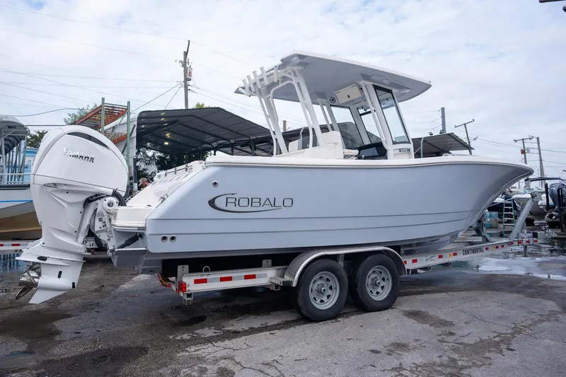 Slide: The Image of 2025 Robalo R270 Center Console boat on trailer, side view. - 25