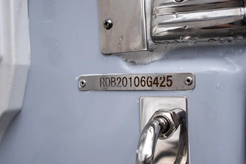 Slide: The Image of 2025 Robalo R270 Center Console boat identification plate and hardware detail. - 26