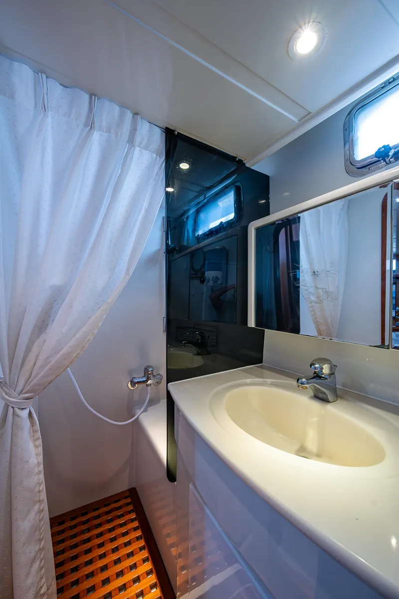 Slide: The Image of Bathroom interior of a 2002 Symbol 42' yacht with sink and shower. - 20