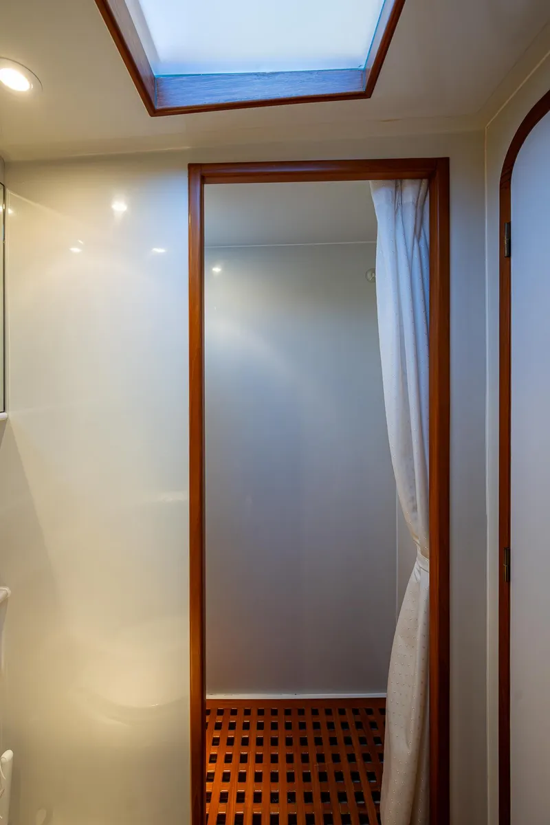 Slide: The Image of Interior of a 2002 Symbol 42' yacht with skylight and wooden accents. - 27