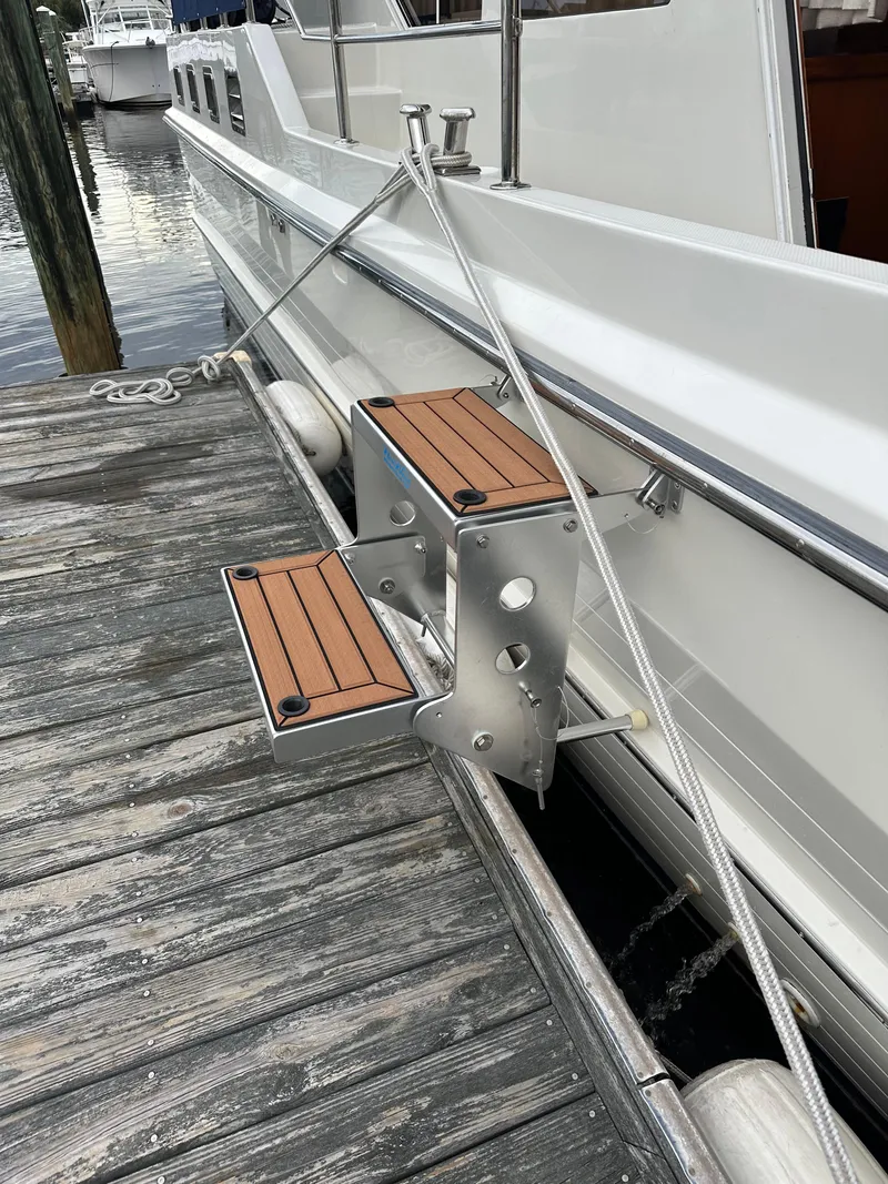 Slide: The Image of Boat docked with wooden steps, Symbol 42', 2002 model. - 46