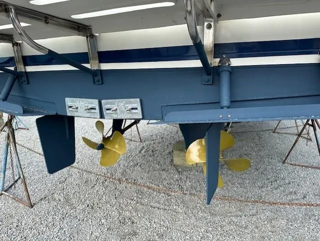 Slide: The Image of Rear view of a 2002 Symbol 42' boat with dual propellers and rudders. - 48