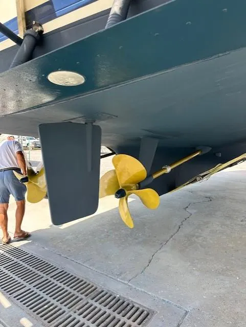 Slide: The Image of Propeller and rudder of 2002 Symbol 42' boat on dry dock. - 49