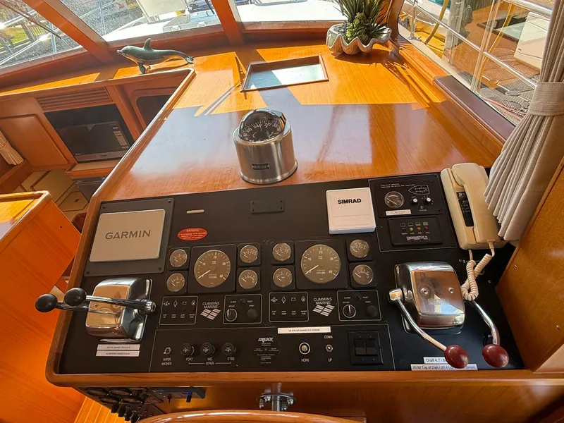 Slide: The Image of Helm of 2002 Symbol 42' yacht with navigation instruments and controls. - 9