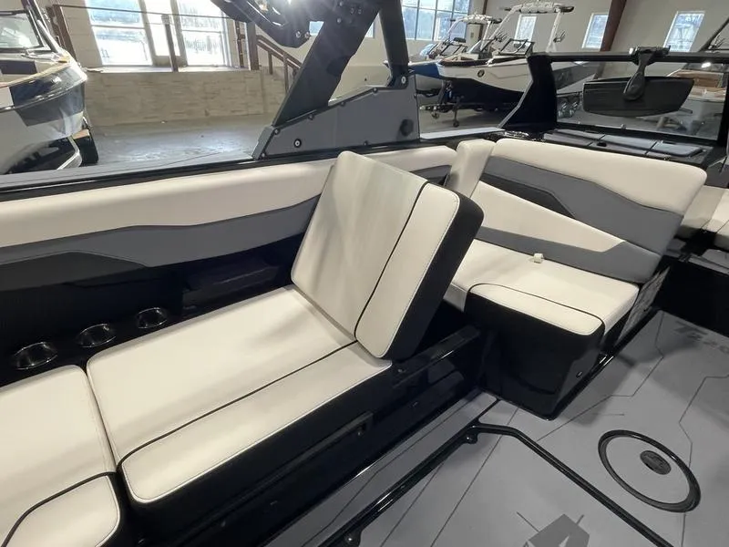 Slide: The Image of 2025 Axis T220 boat interior with modern seating and sleek design. - 13