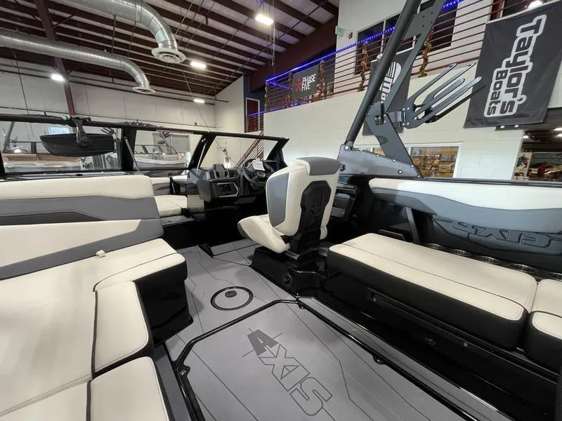 Slide: The Image of Interior of 2025 Axis T220 boat with modern seating and sleek design. - 14